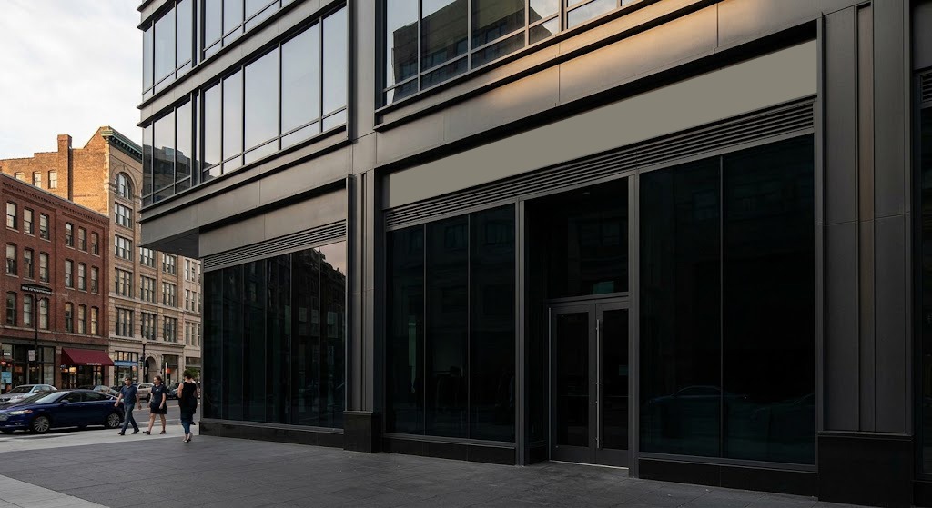 Urban storefront façade with dark tinted glass panels